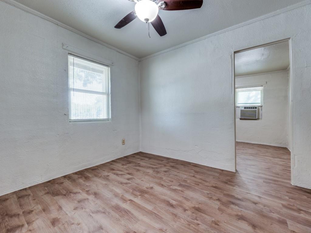3440 Terrell Street Dallas, TX 75223 - Photo 7 of 11 wooden floor in an empty room with a window