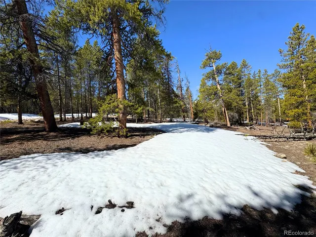 a view of a lush green hillside and houses