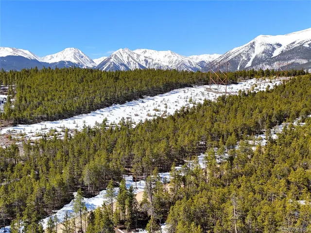 a view of a town with mountains in the background