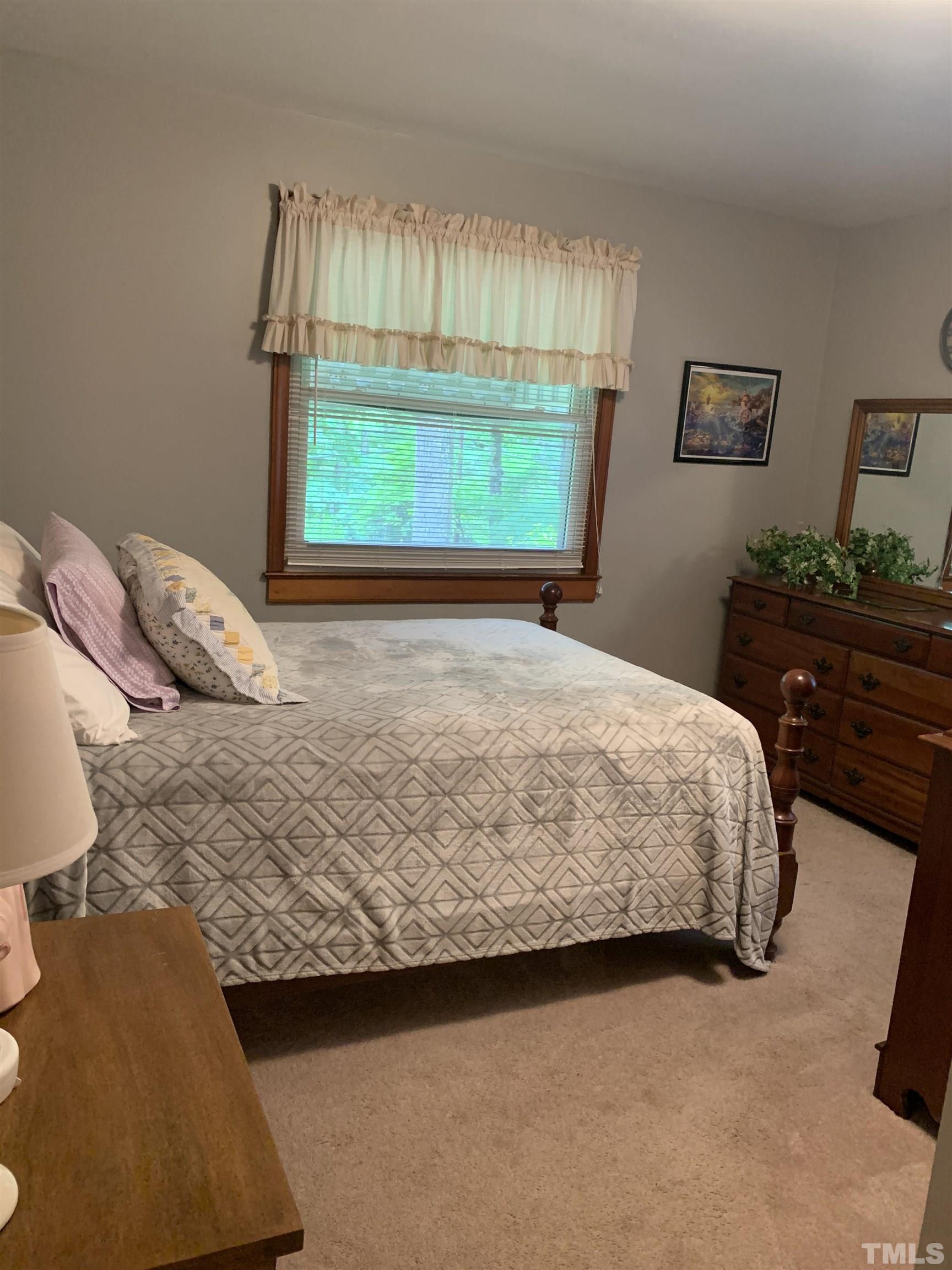 2804 Sparger Road Durham, NC 27705 - Photo 12 of 34 a bedroom with a bed and window