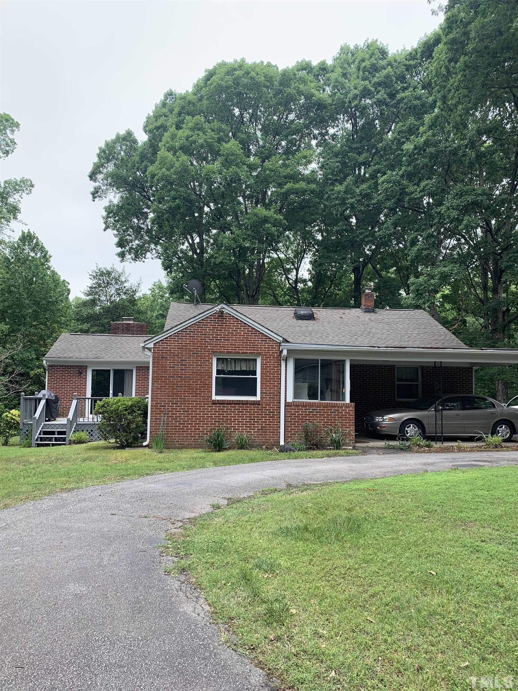2804 Sparger Road Durham, NC 27705 - Photo 16 of 34 a house view with outdoor space and garden
