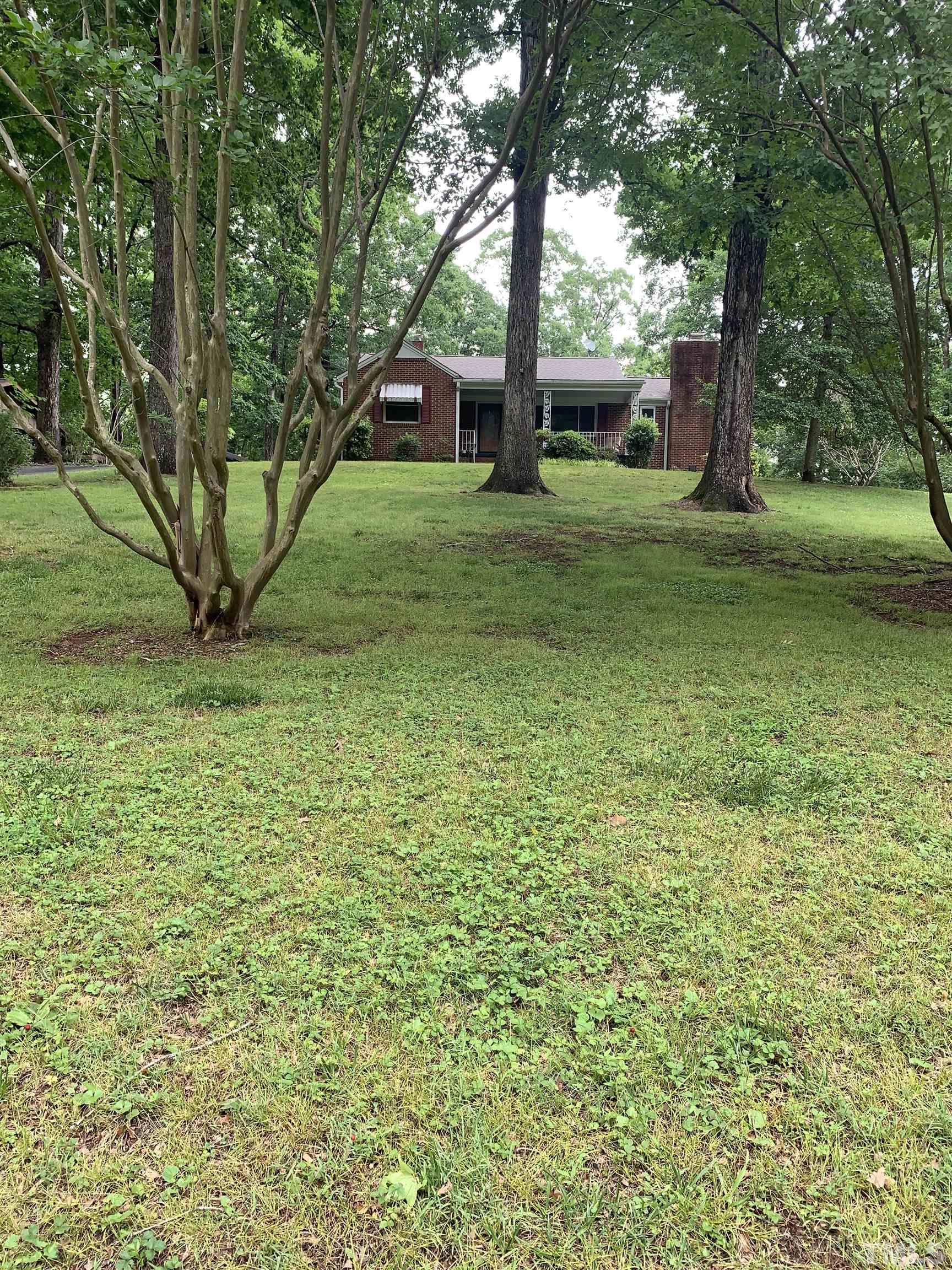 2804 Sparger Road Durham, NC 27705 - Photo 19 of 34 a view of a backyard with large trees