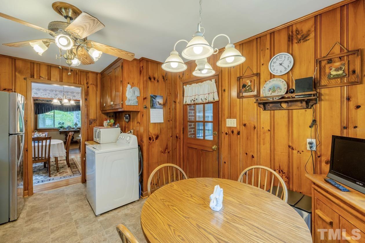2804 Sparger Road Durham, NC 27705 - Photo 24 of 34 a view of a dining room with furniture window and wooden floor