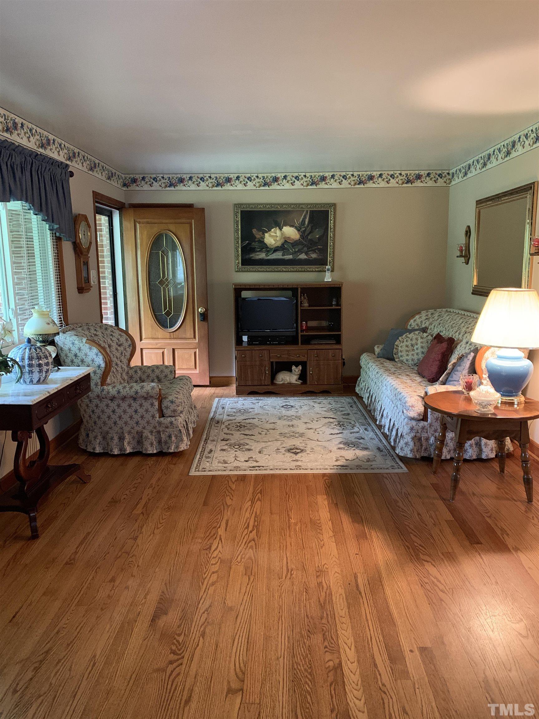 2804 Sparger Road Durham, NC 27705 - Photo 3 of 34 a living room with furniture and a wooden floor