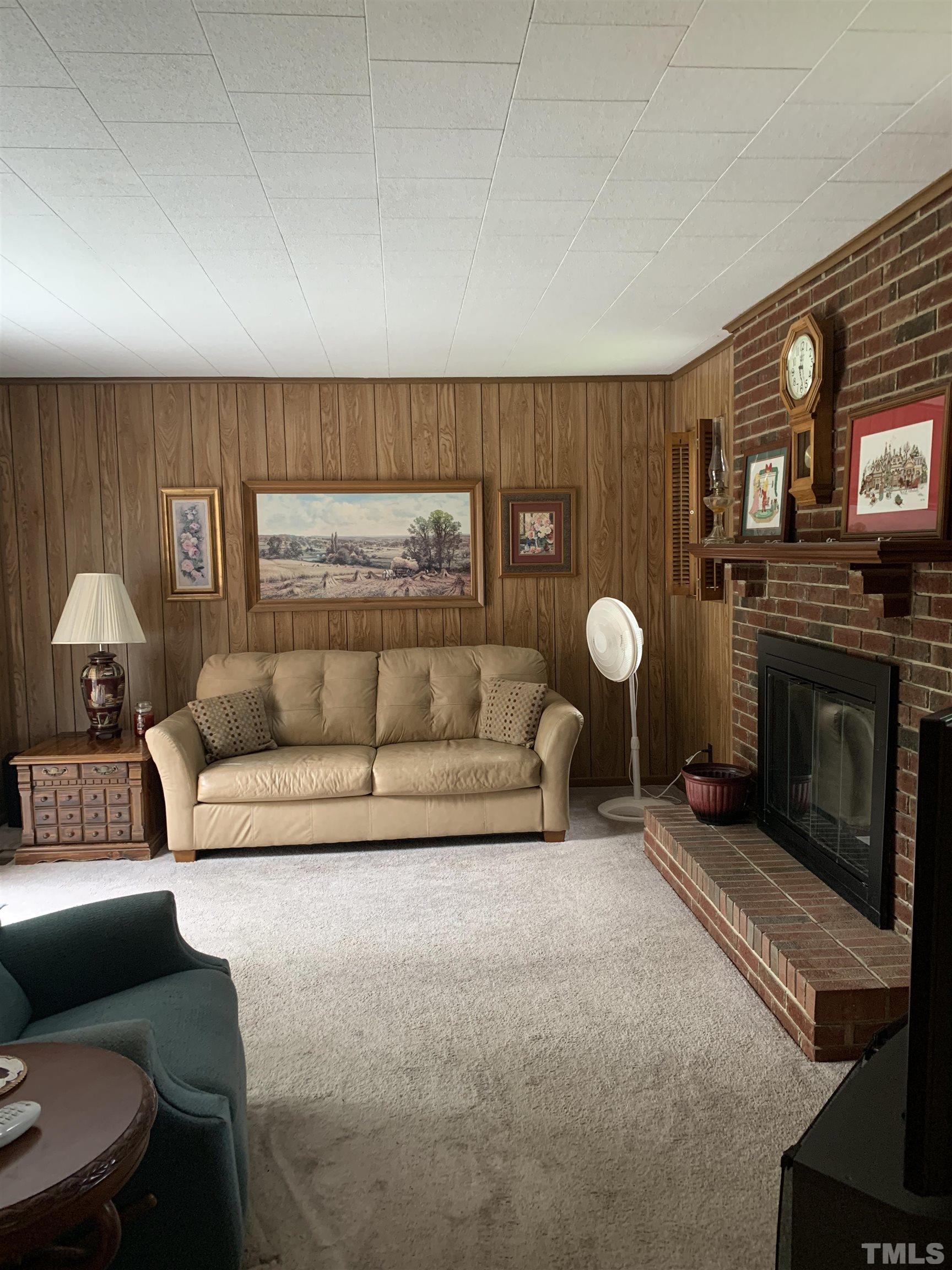 2804 Sparger Road Durham, NC 27705 - Photo 5 of 34 a living room with furniture and a fireplace