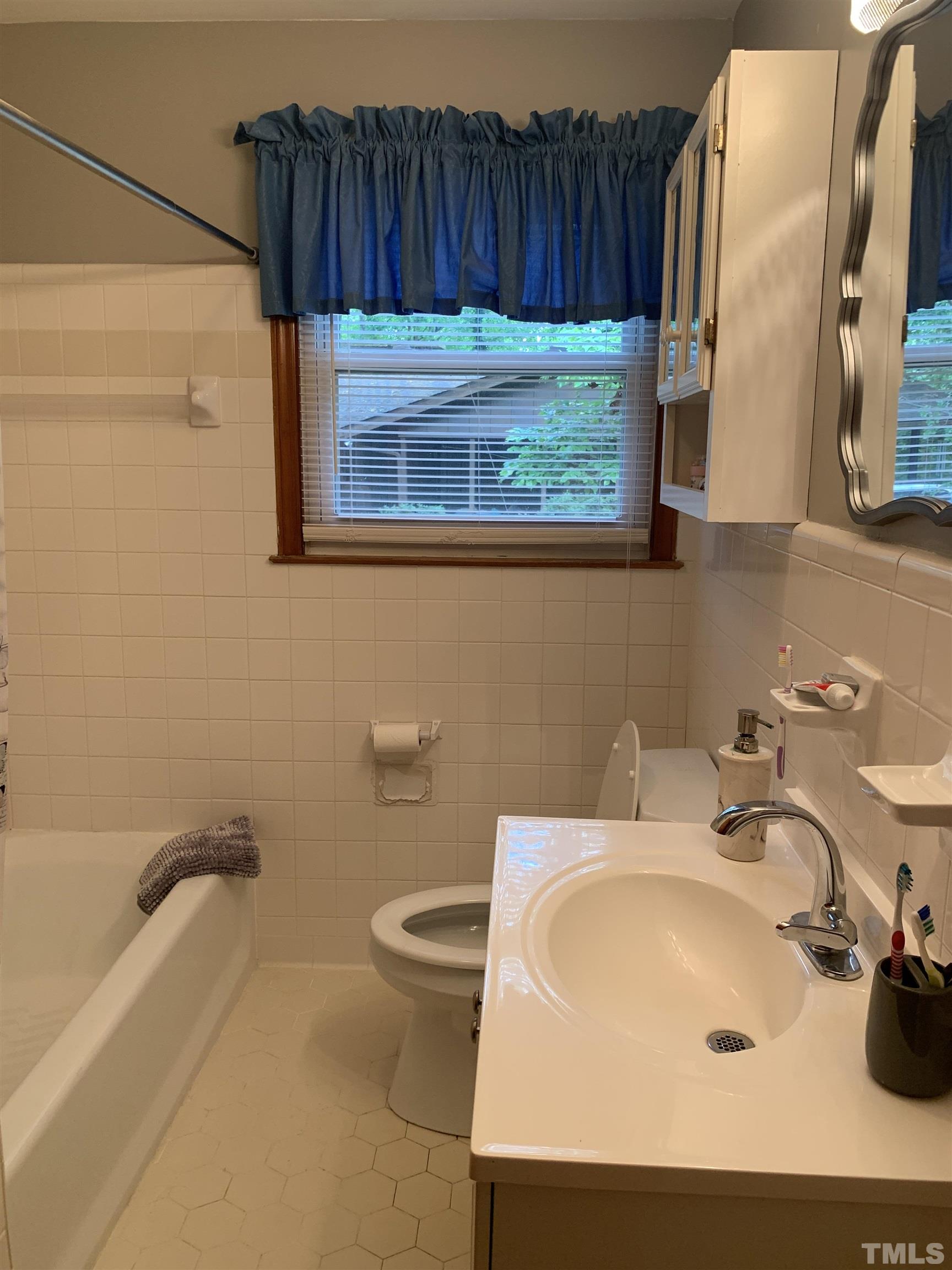 2804 Sparger Road Durham, NC 27705 - Photo 9 of 34 a bathroom with a sink and a toilet