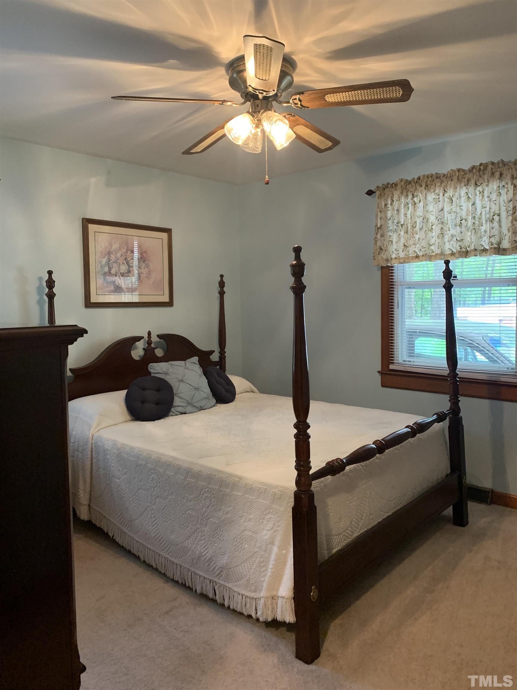 2804 Sparger Road Durham, NC 27705 - Photo 10 of 34 a bedroom with a bed and window