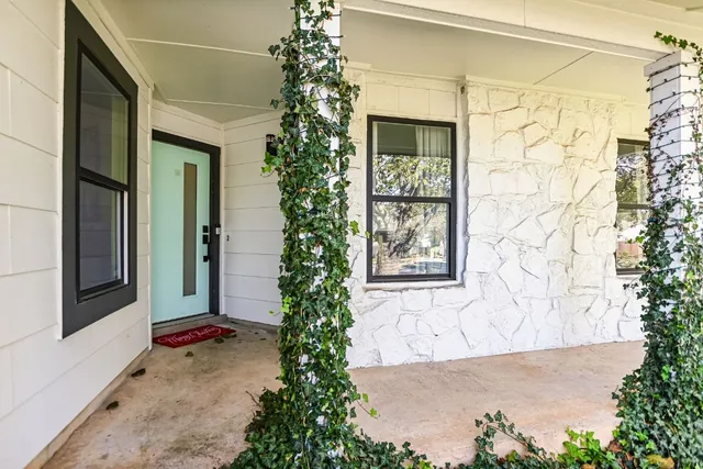 a view of dining room with furniture and wooden floor