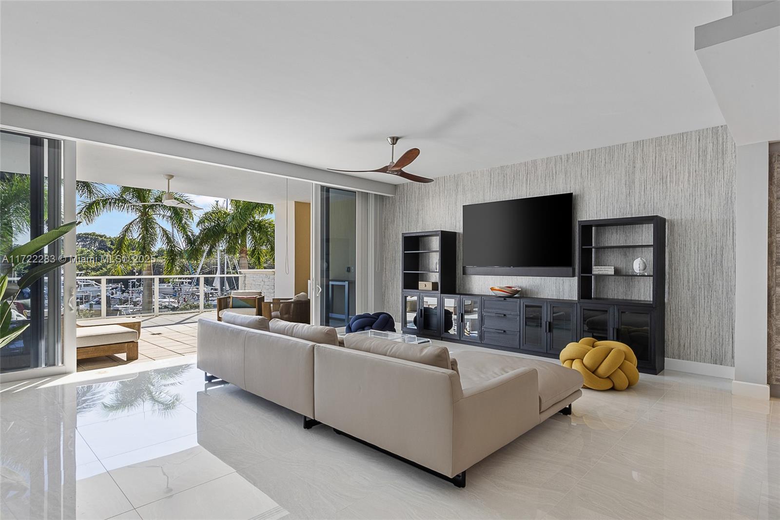 2720 Donald Ross Road, Unit 206 Palm Beach Gardens, FL 33410 - Photo 5 of 40 a living room with furniture and a flat screen tv