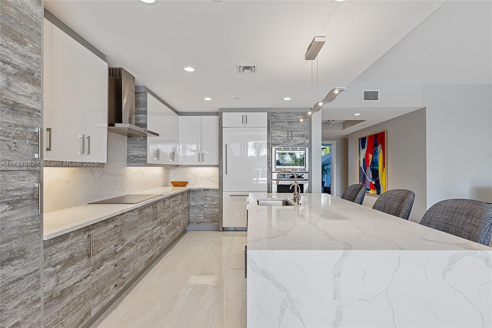 2720 Donald Ross Road, Unit 206 Palm Beach Gardens, FL 33410 - Photo 9 of 40 a large kitchen with cabinets