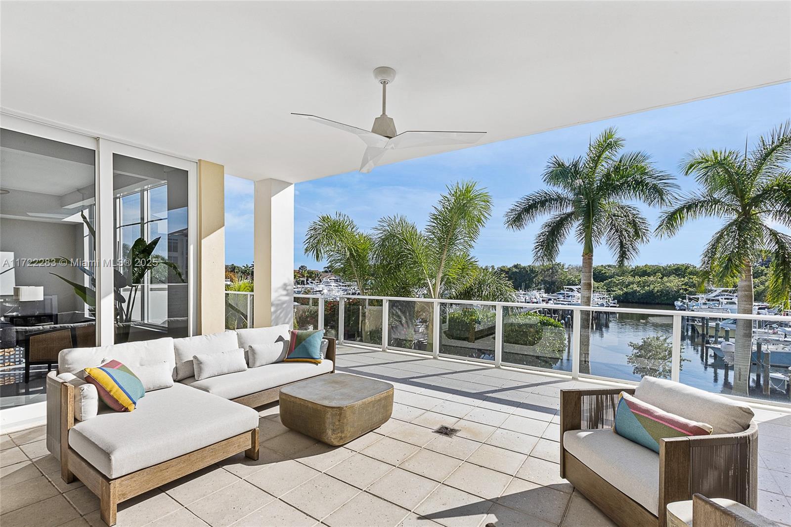 2720 Donald Ross Road, Unit 206 Palm Beach Gardens, FL 33410 - Photo 10 of 40 a living room with furniture potted plant and a large window