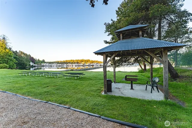 a view of a table and chairs under an umbrella