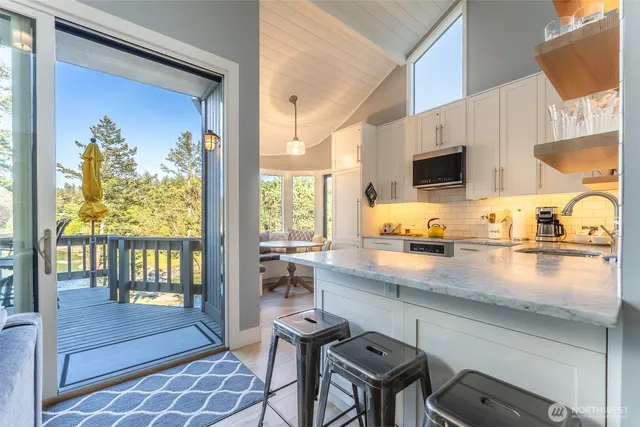 a kitchen with a sink cabinets and outdoor view