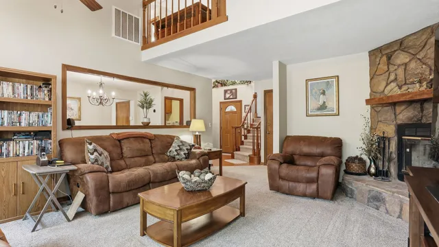 a bathroom with a sink a toilet a mirror and shower curtain