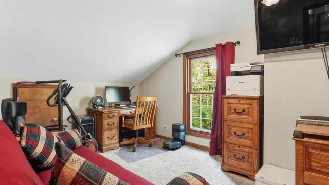 a utility room with dryer washer and a view of living room