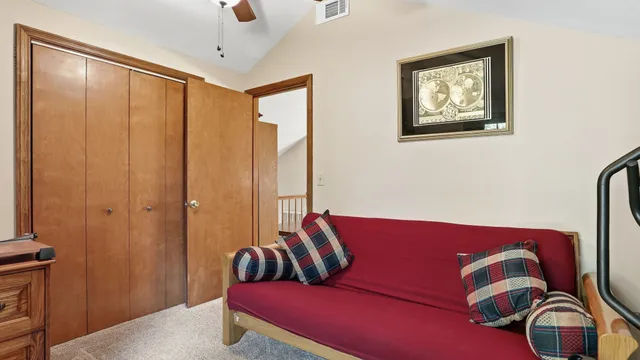 a view of a deck with wooden floor and fence next to a yard