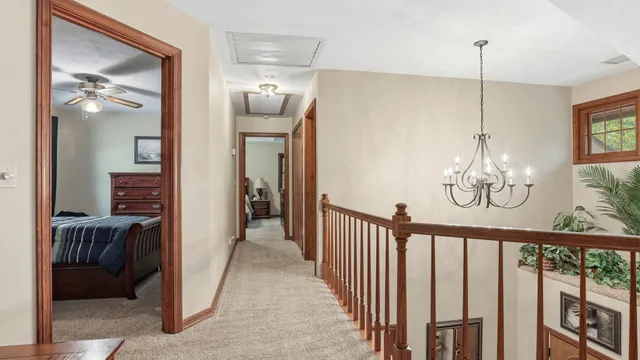 a view of a balcony with wooden floor and outdoor seating