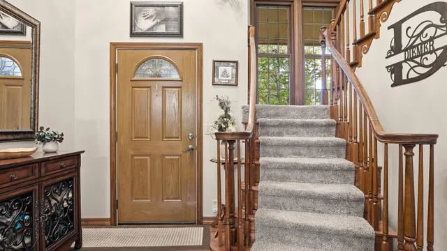 a kitchen with stainless steel appliances granite countertop a kitchen island hardwood floor and a sink