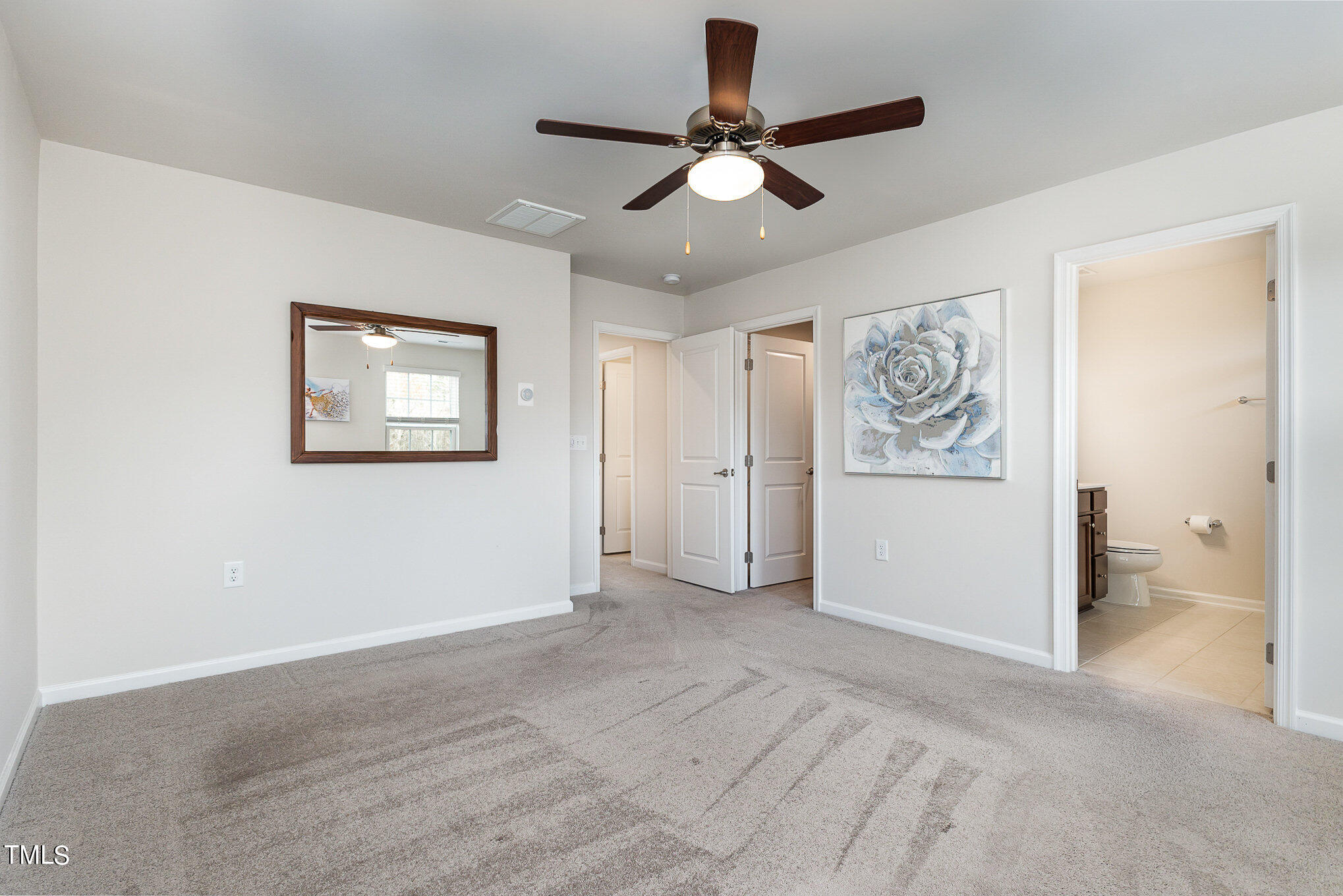 4845 Randall Road Durham, NC 27707 - Photo 8 of 17 a view of a livingroom with a ceiling fan & a ceiling fan