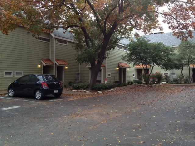 a view of a car in front of house