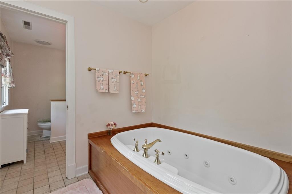 4661 Old Mercer Road Volant, PA 16156 - Photo 21 of 25 "shared" whirlpool tub between the two full baths