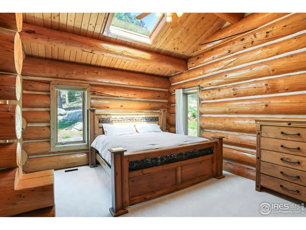 a bed room with a bed and a window