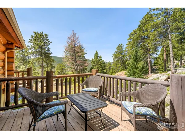 a view of a two chairs on the roof deck