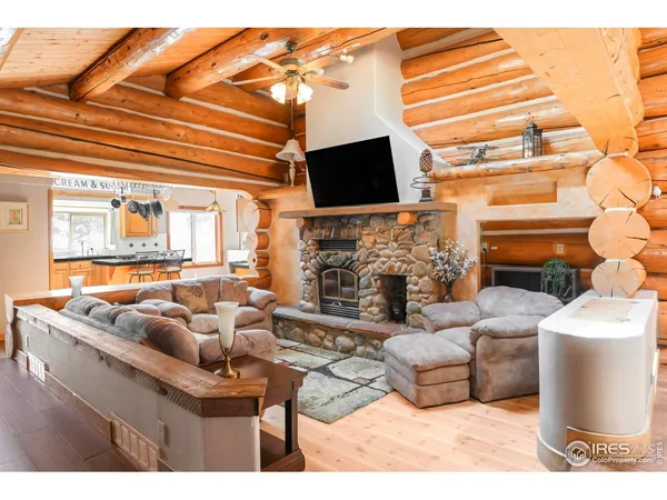 a living room with fireplace furniture and a flat screen tv