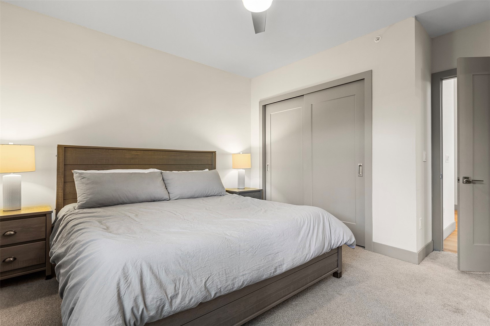 75 West 4th Street, Unit 305W Silverthorne, CO 80498 - Photo 15 of 30 a bedroom with a bed and a lamp