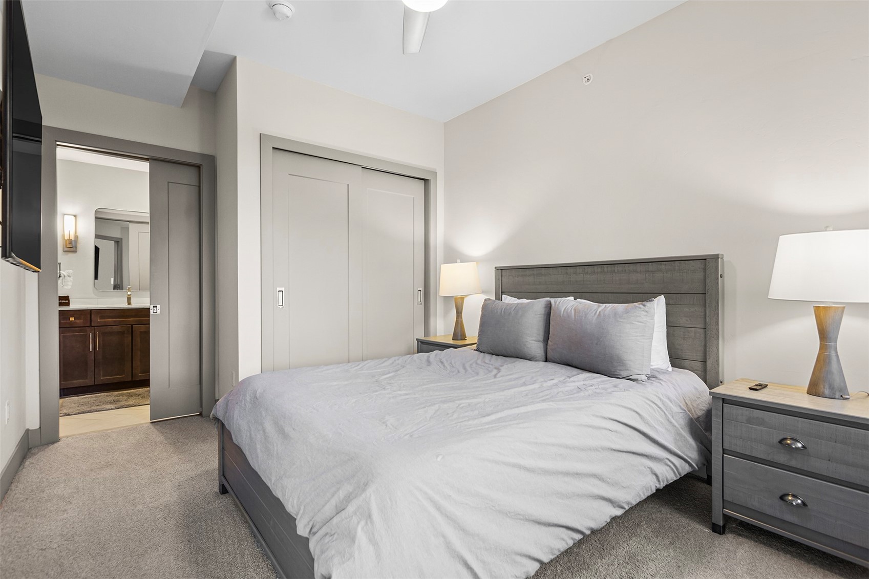 75 West 4th Street, Unit 305W Silverthorne, CO 80498 - Photo 19 of 30 a bedroom with a bed and a view of bathroom