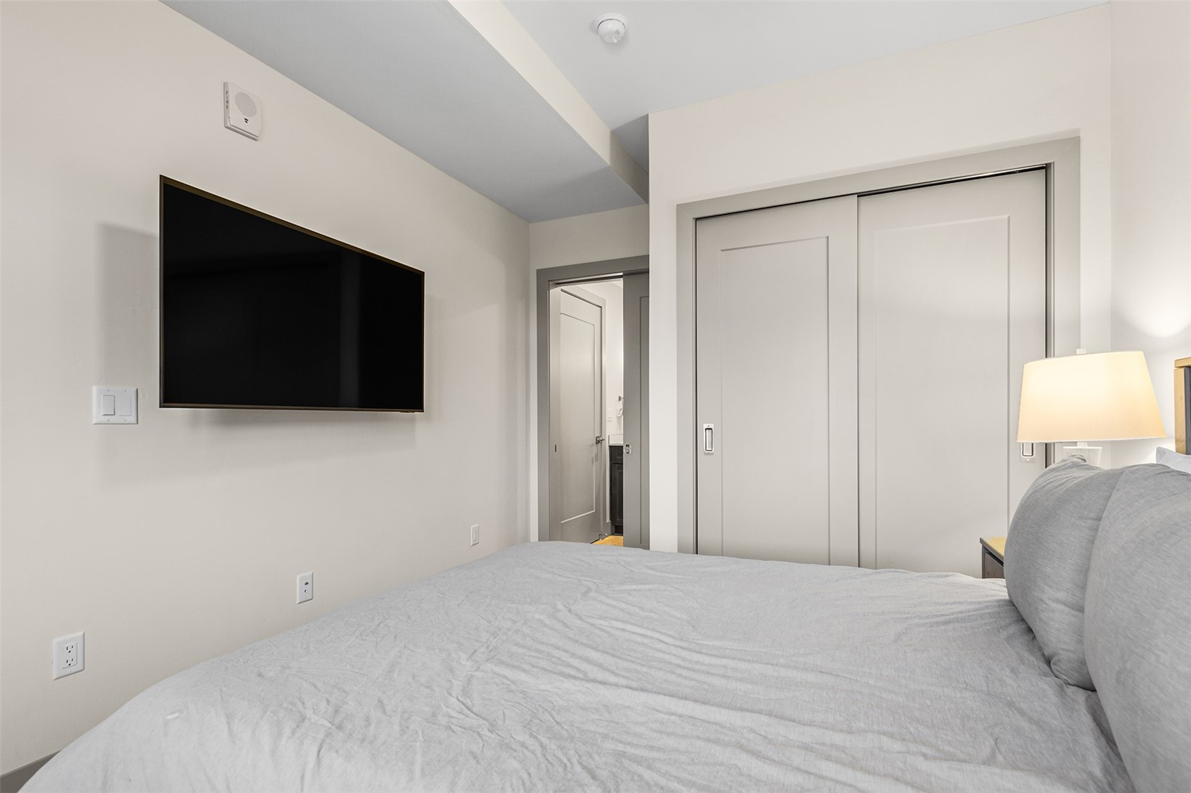 75 West 4th Street, Unit 305W Silverthorne, CO 80498 - Photo 20 of 30 a bedroom with a bed and a flat screen tv