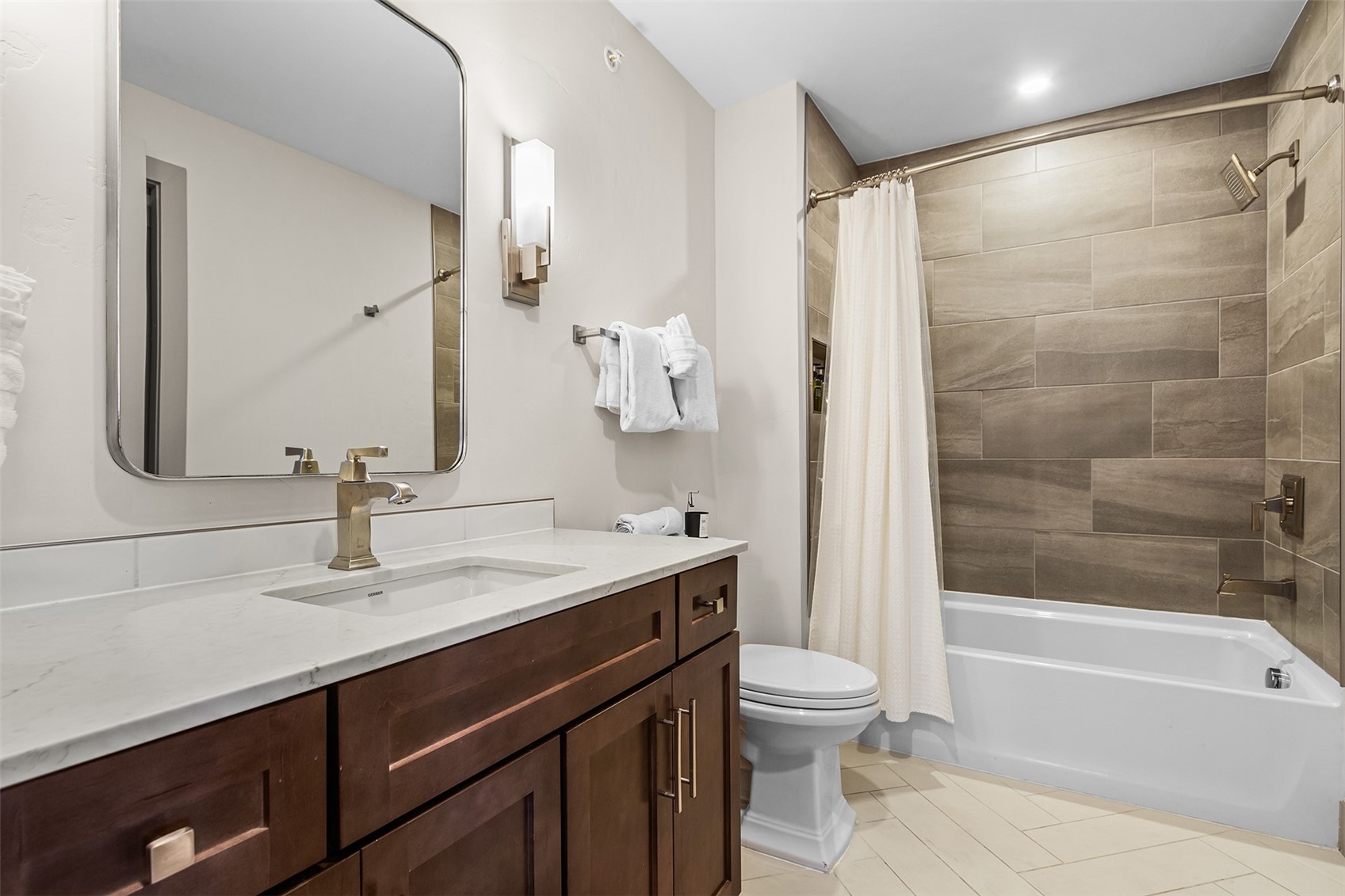 75 West 4th Street, Unit 305W Silverthorne, CO 80498 - Photo 22 of 30 a bathroom with a sink a toilet and a mirror