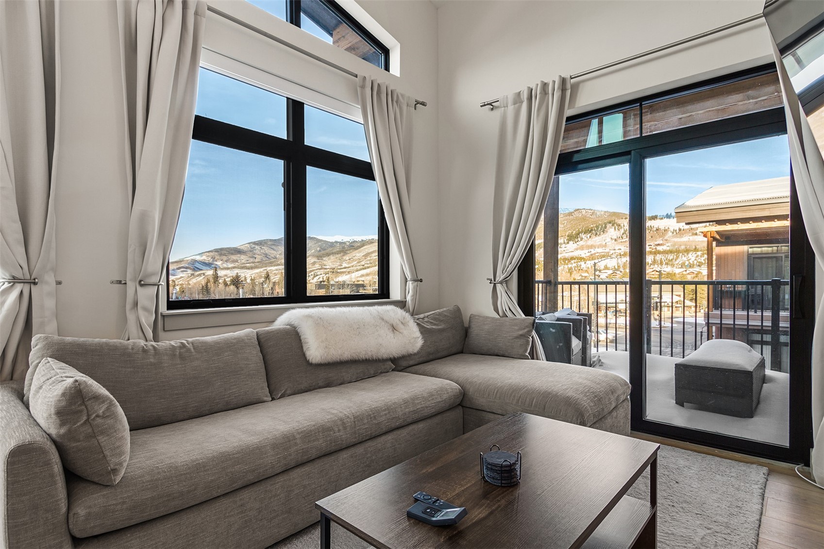 75 West 4th Street, Unit 305W Silverthorne, CO 80498 - Photo 6 of 30 a living room with furniture and a large window