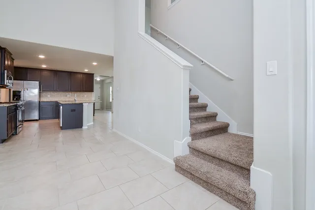 a view of kitchen and living room with a fireplace