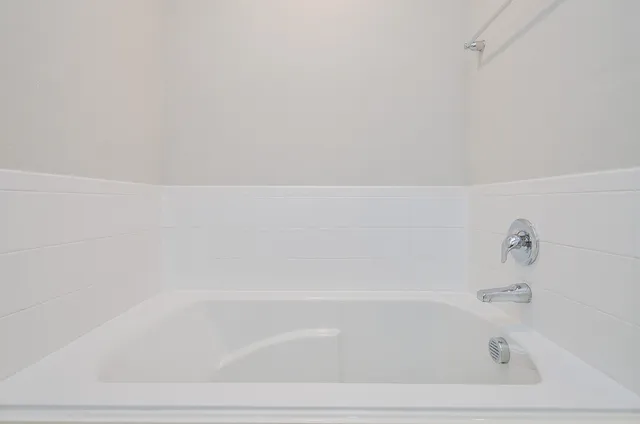 a close view of a bathtub in bathroom