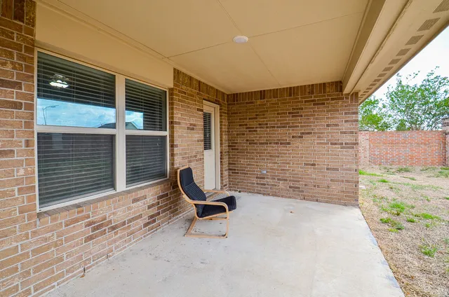 a backyard of a house with seating space