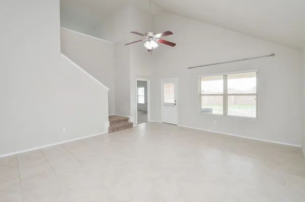 a view of an empty room with a window