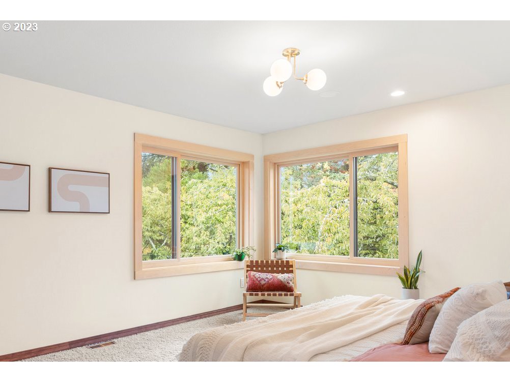8425 Southwest Ridgeway Drive Portland, OR 97225 - Photo 11 of 41 a living room with furniture and a large window