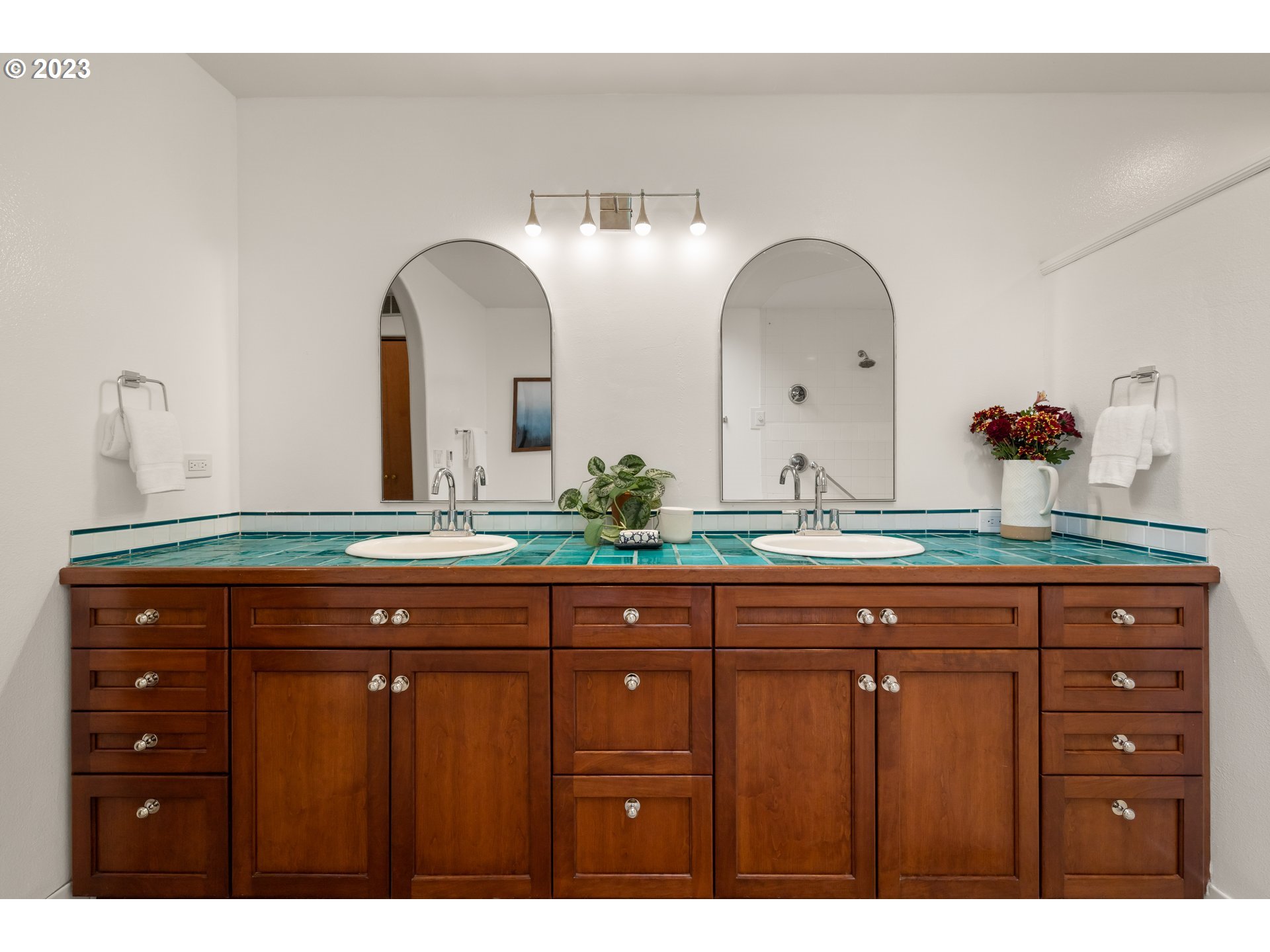 8425 Southwest Ridgeway Drive Portland, OR 97225 - Photo 13 of 41 a bathroom with a granite countertop sink and a mirror