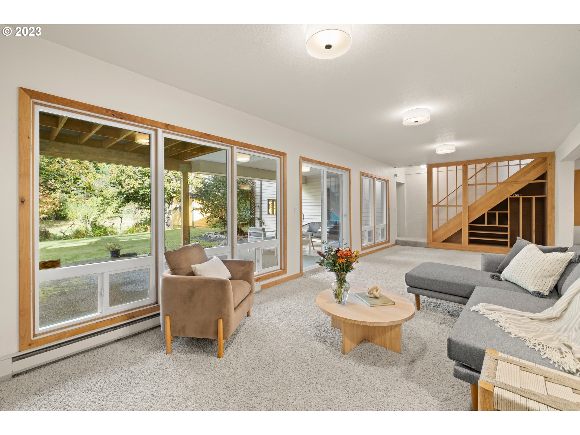 8425 Southwest Ridgeway Drive Portland, OR 97225 - Photo 19 of 41 a living room with furniture and a large window