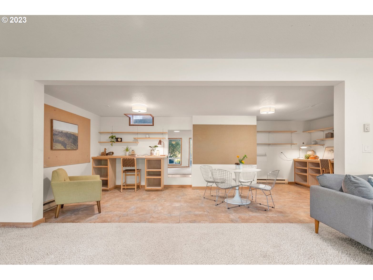 8425 Southwest Ridgeway Drive Portland, OR 97225 - Photo 20 of 41 a living room with furniture and a flat screen tv
