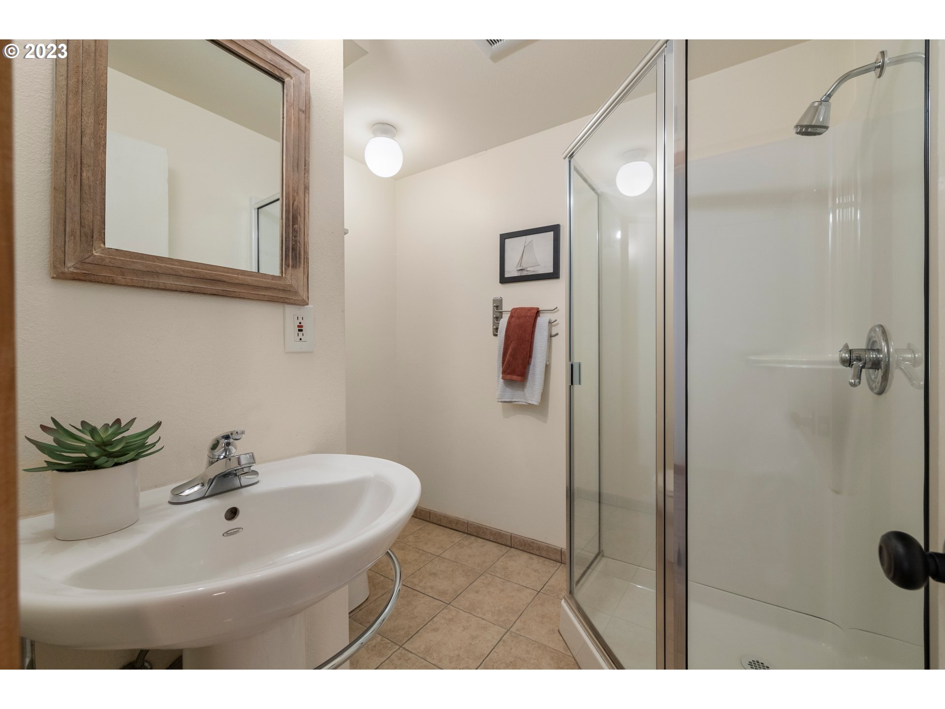 8425 Southwest Ridgeway Drive Portland, OR 97225 - Photo 23 of 41 a bathroom with a sink and mirror