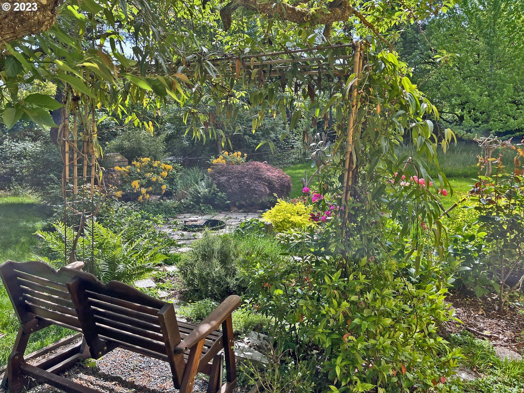 8425 Southwest Ridgeway Drive Portland, OR 97225 - Photo 35 of 41 a backyard of a house with outdoor seating