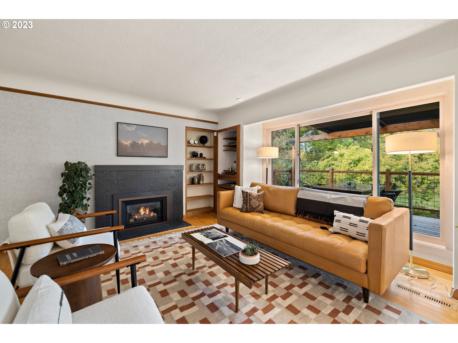 8425 Southwest Ridgeway Drive Portland, OR 97225 - Photo 7 of 41 a living room with furniture large window and a fireplace