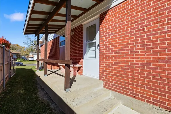 a view of a backyard with a garden and deck