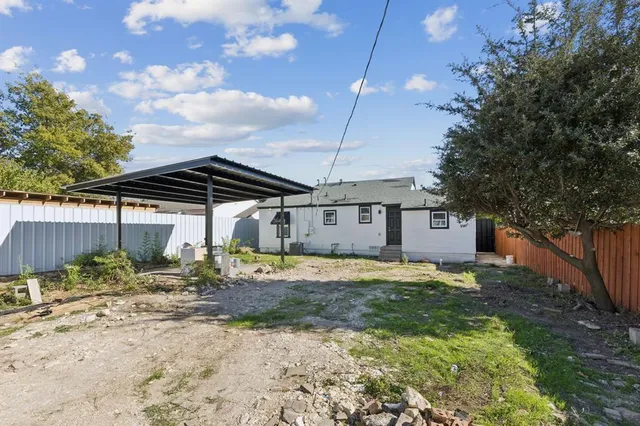 a house view with a backyard space