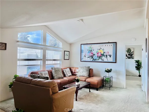 a living room with furniture a window and a couch