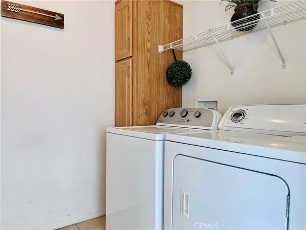 a bathroom with a toilet a sink and a window