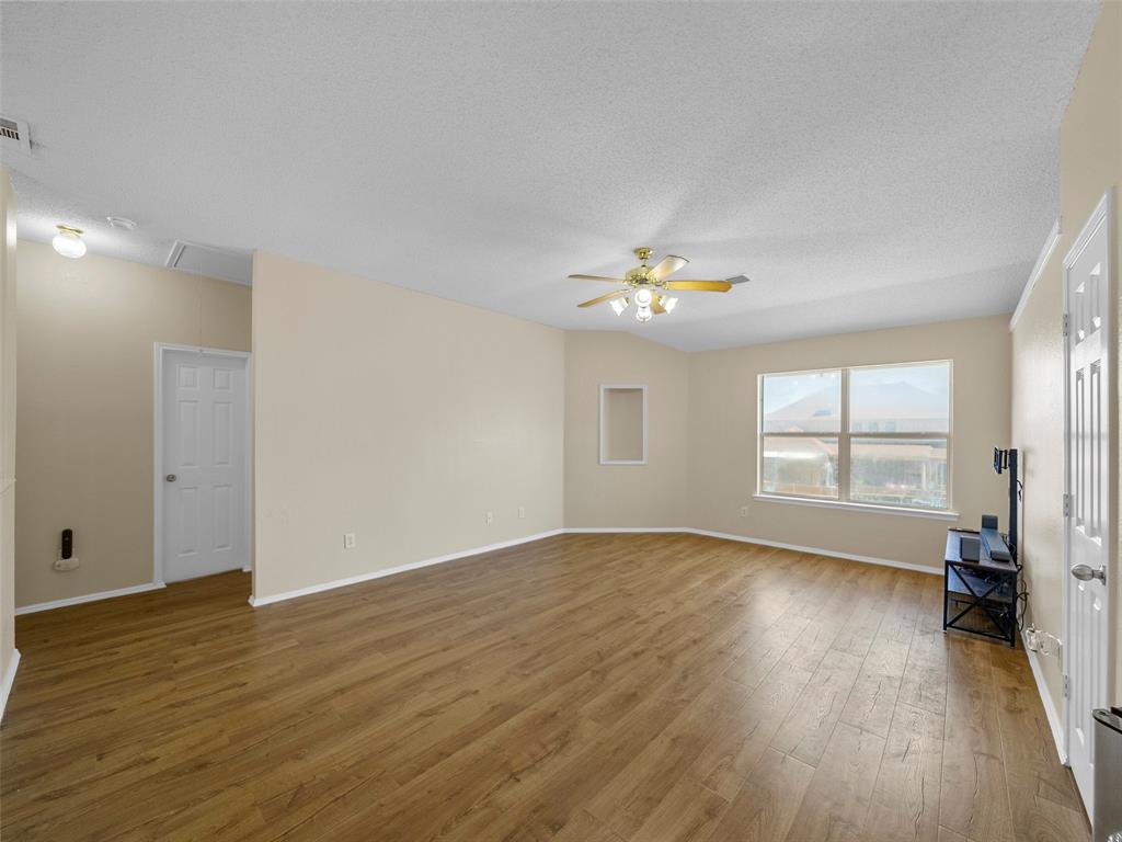 741 Aspen Court Allen, TX 75002 - Photo 28 of 40 Upstairs living room featuring dark wood-style flooring, and ceiling fan