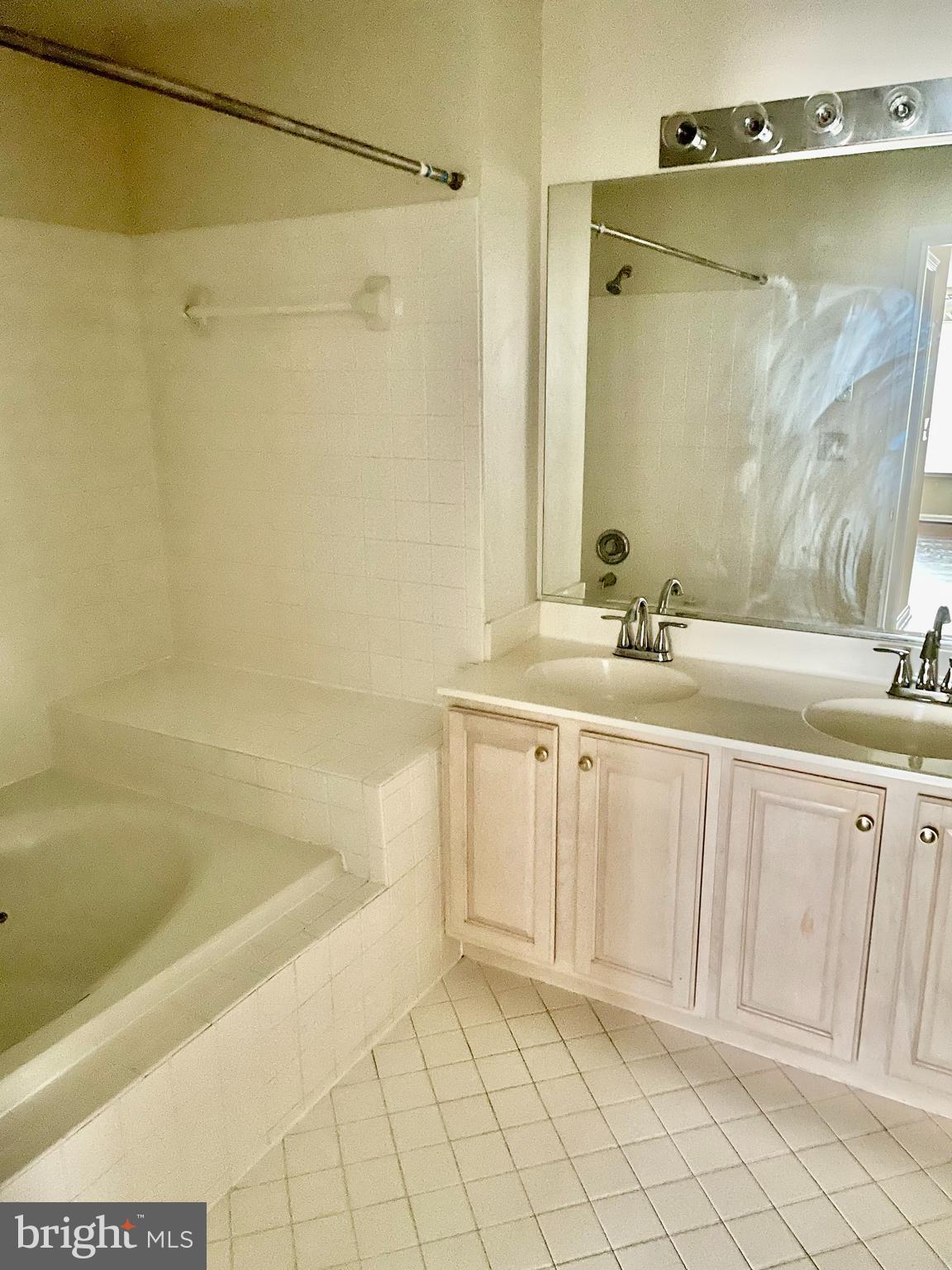102 Kendrick Place, Unit 10222 Gaithersburg, MD 20878 - Photo 11 of 17 a bathroom with a sink and a mirror